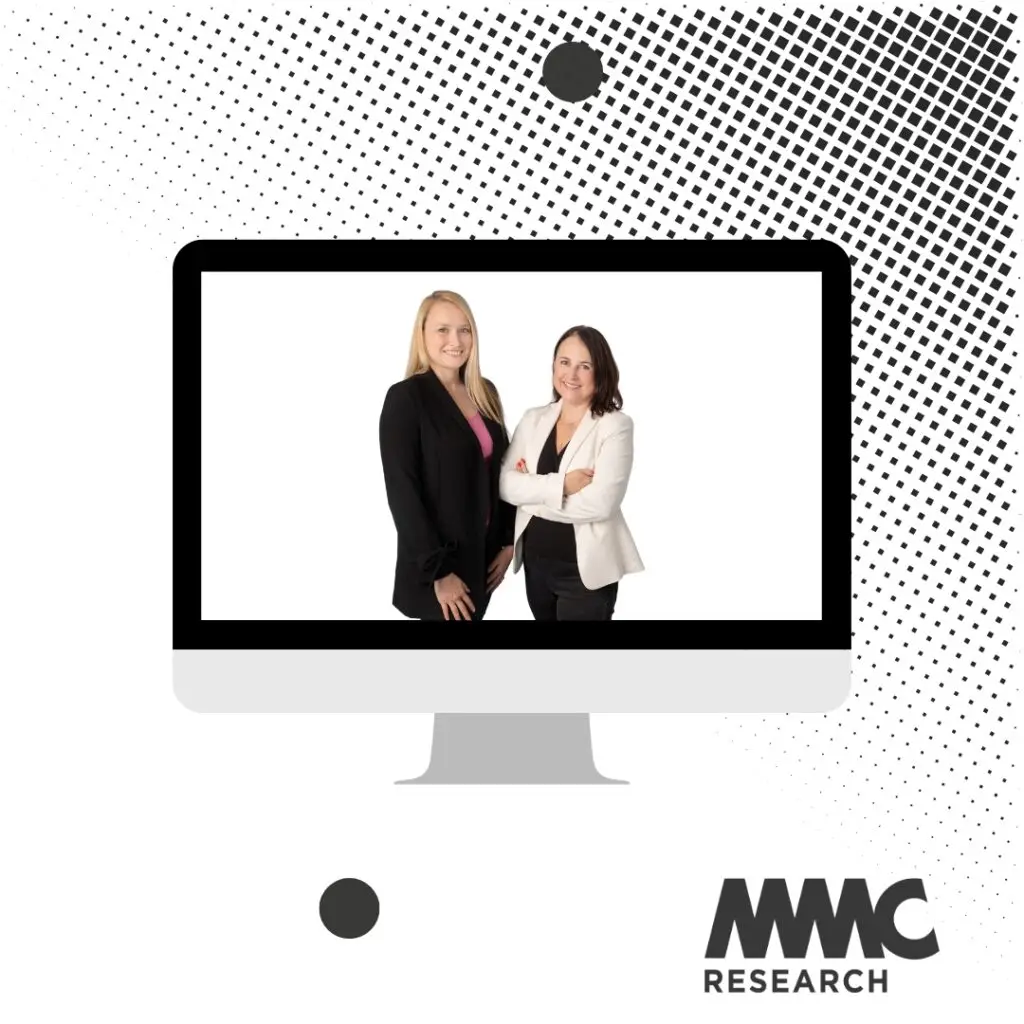 Photo of two women in business dress, smiling at the camera, on a digital image of a Macbook on aa white background with black dots.